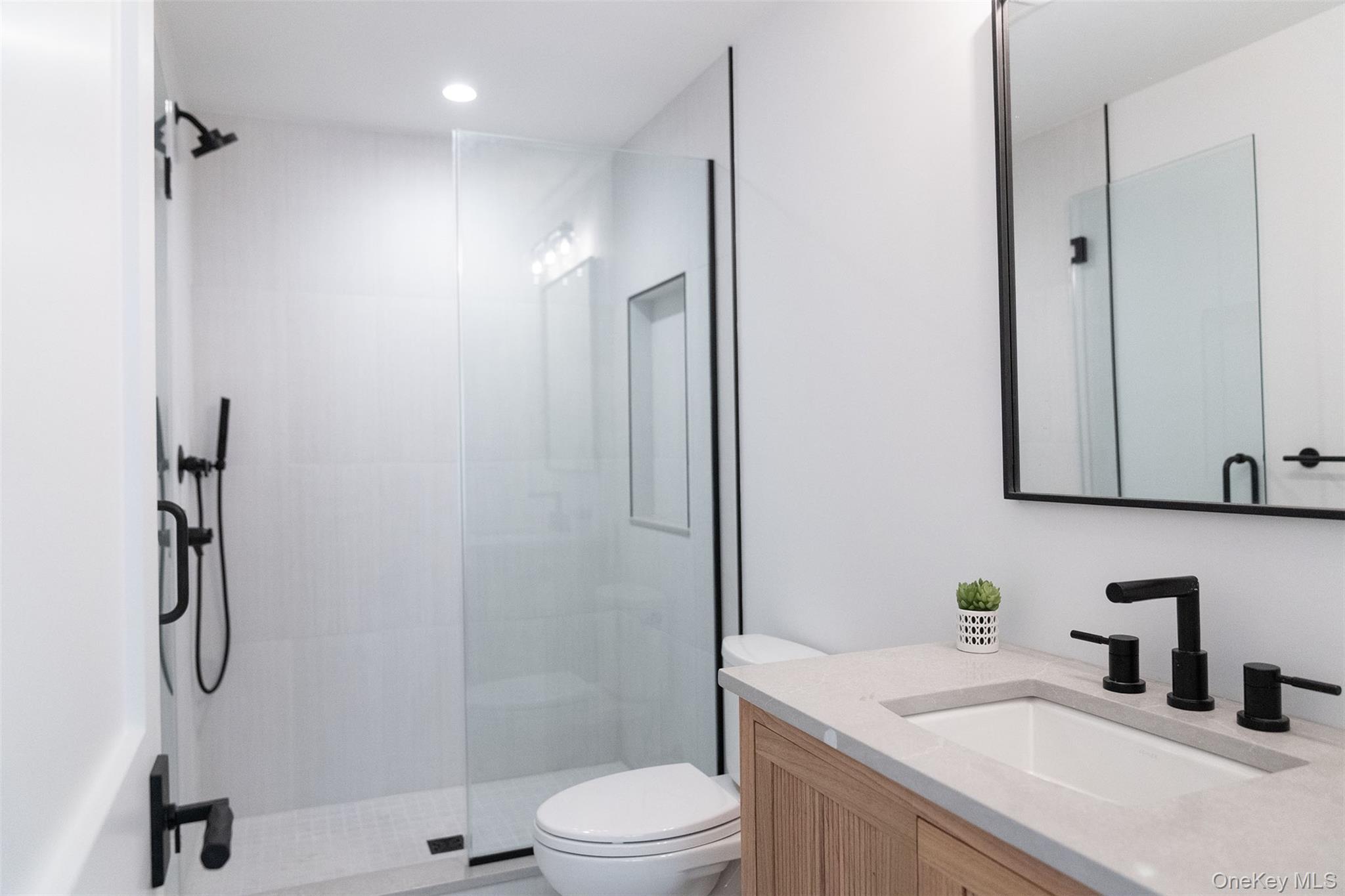 465 Ripple Water Lane Southold, NY 11971 - Photo 30 of 46 Bathroom with vanity and a shower stall
