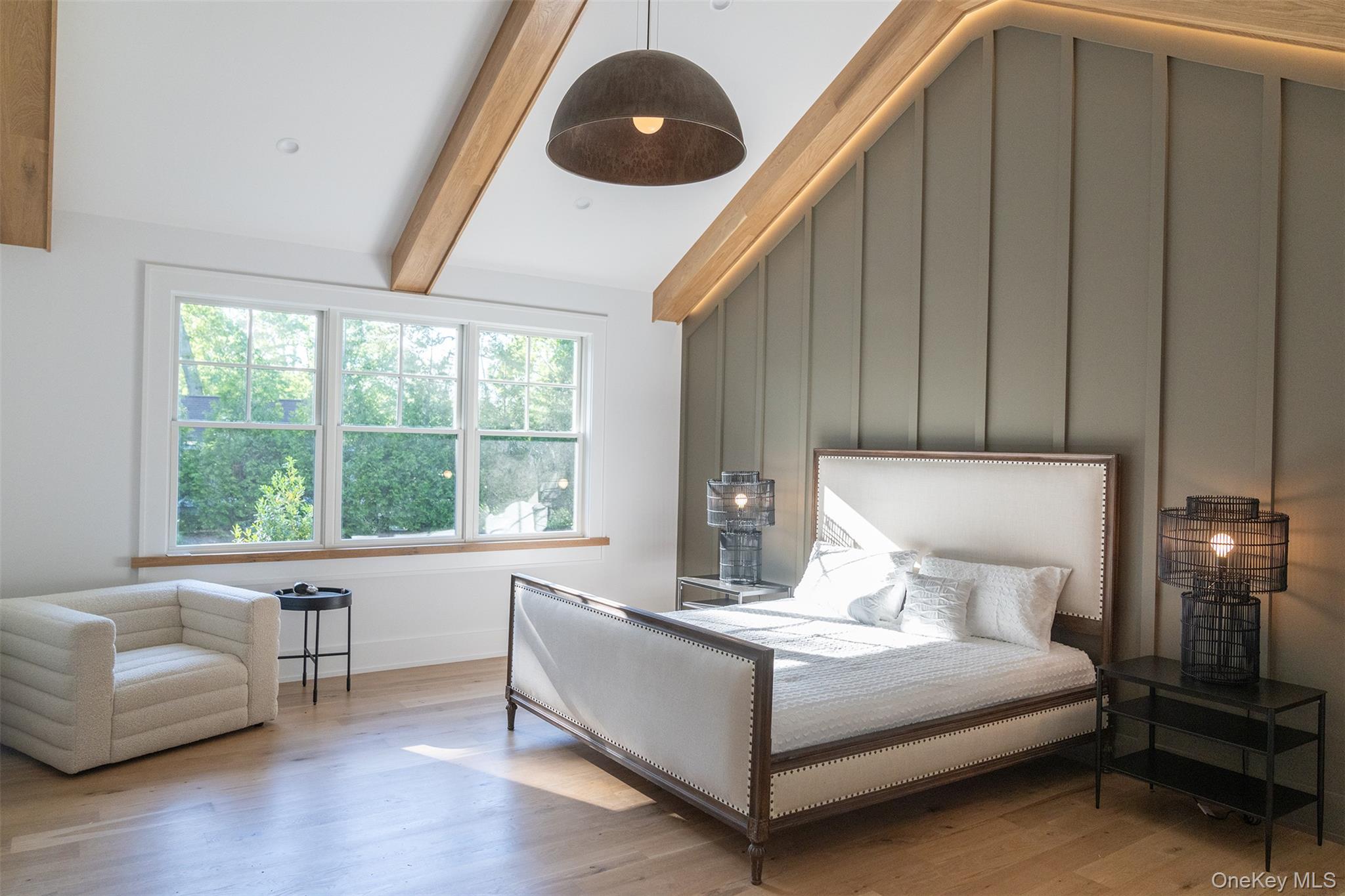 465 Ripple Water Lane Southold, NY 11971 - Photo 38 of 47 Bedroom with wood finished floors, a decorative wall, and ceiling fan