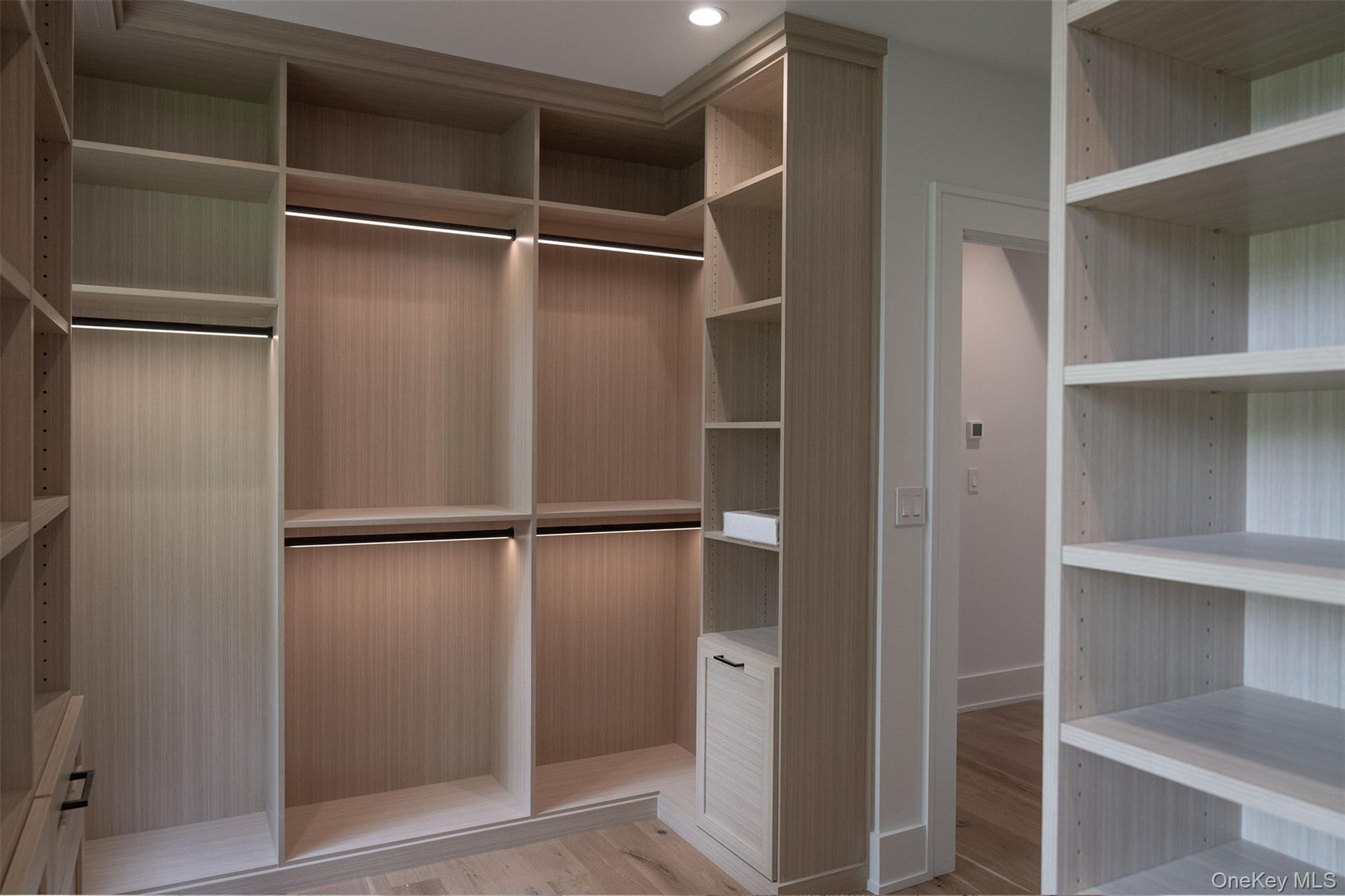 465 Ripple Water Lane Southold, NY 11971 - Photo 41 of 47 Walk in closet with light wood finished floors