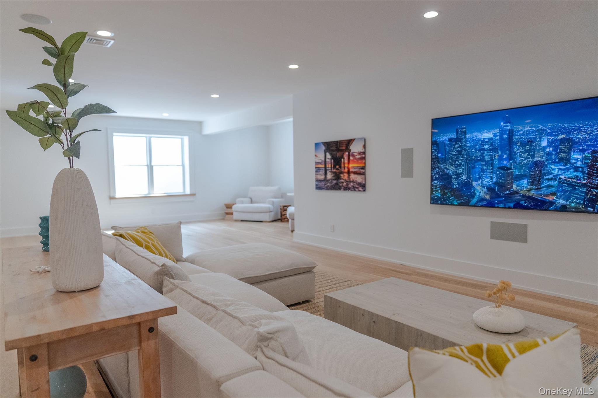 465 Ripple Water Lane Southold, NY 11971 - Photo 43 of 47 Living area with wood finished floors and recessed lighting