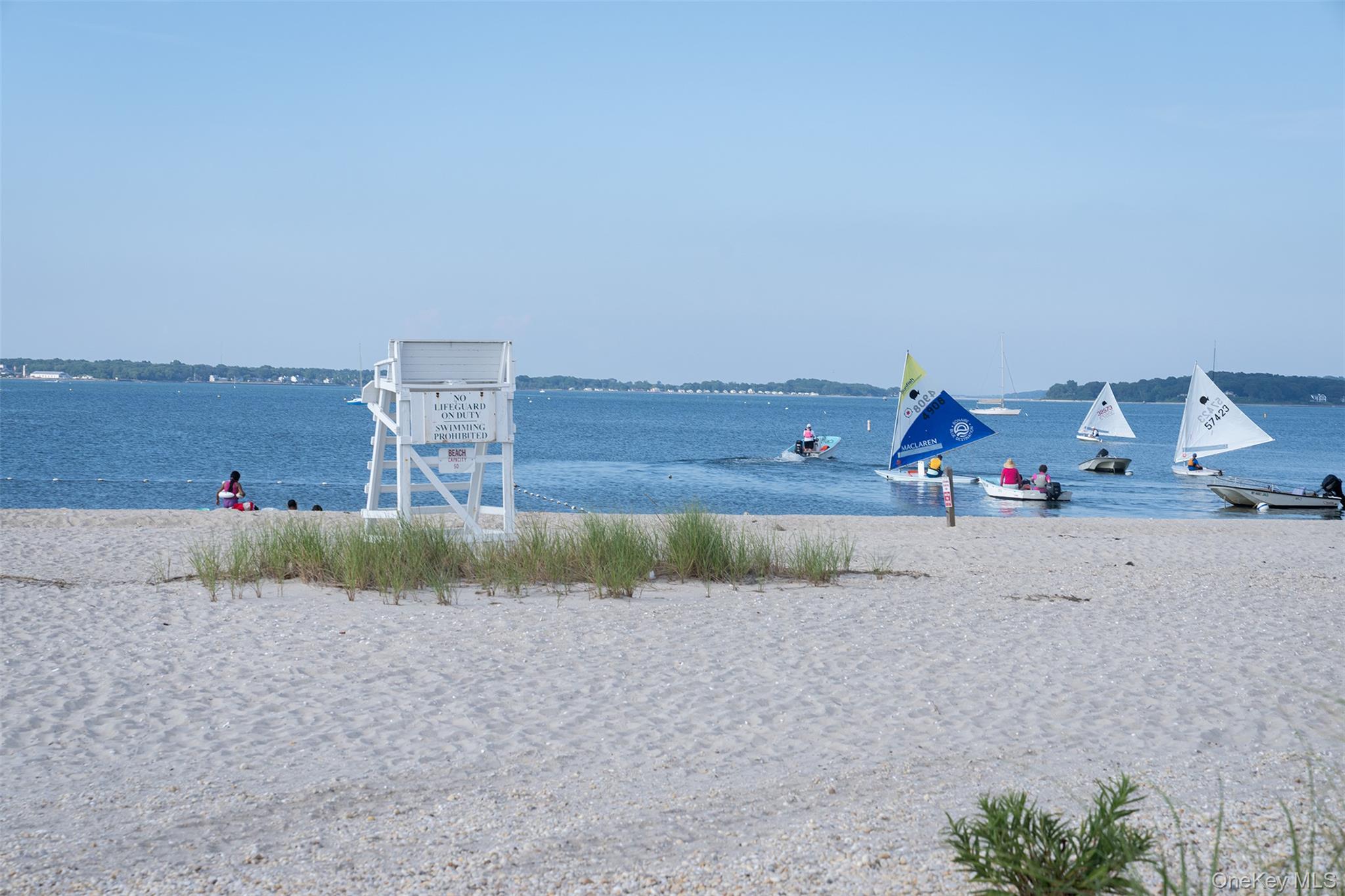 465 Ripple Water Lane Southold, NY 11971 - Photo 44 of 46 Goose Creek beach is a short trip on the paddle board in the neighborhood storage rack to the beach and back.