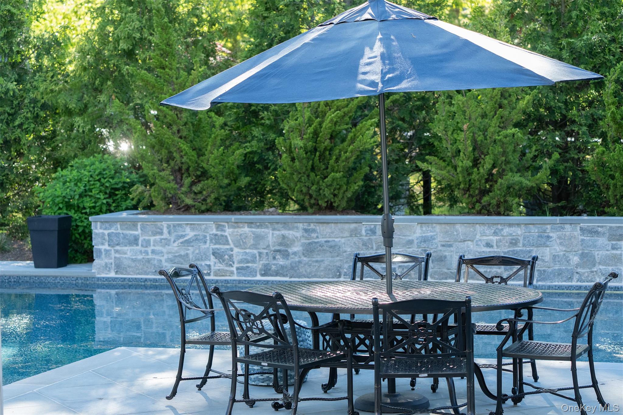 465 Ripple Water Lane Southold, NY 11971 - Photo 5 of 47 View of patio with outdoor dining space and an outdoor pool