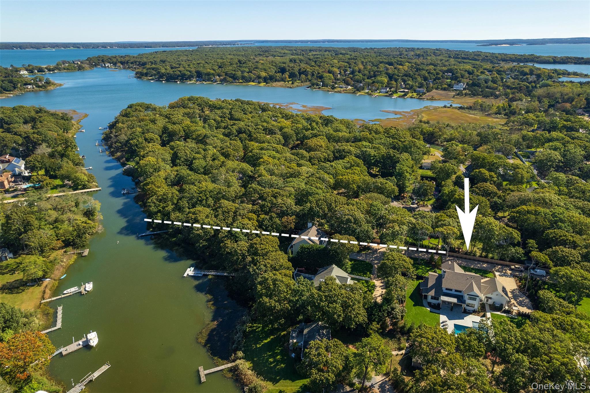 465 Ripple Water Lane Southold, NY 11971 - Photo 9 of 47 Aerial view of a large body of water and a heavily wooded area