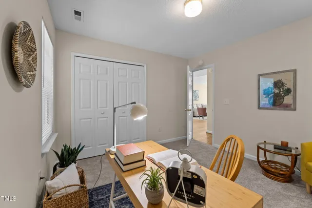 a view of a workspace with furniture and couch