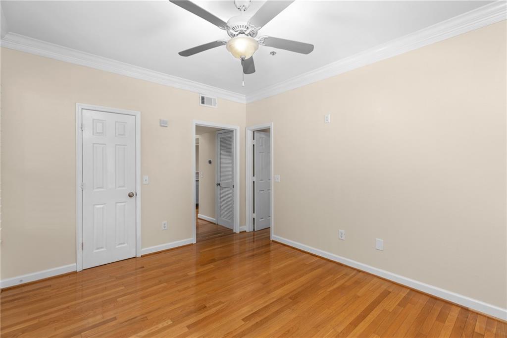 3777 Peachtree Road Northeast, Unit 1529 Atlanta, GA 30319 - Photo 15 of 45 a view of an empty room with wooden floor