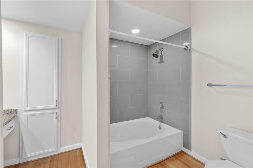 3777 Peachtree Road Northeast, Unit 1529 Atlanta, GA 30319 - Photo 18 of 45 a bathroom with a sink a toilet and shower