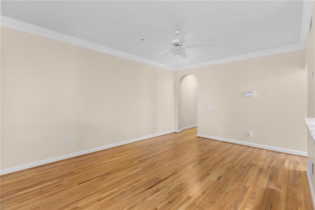 3777 Peachtree Road Northeast, Unit 1529 Atlanta, GA 30319 - Photo 6 of 45 a view of an empty room with wooden floor