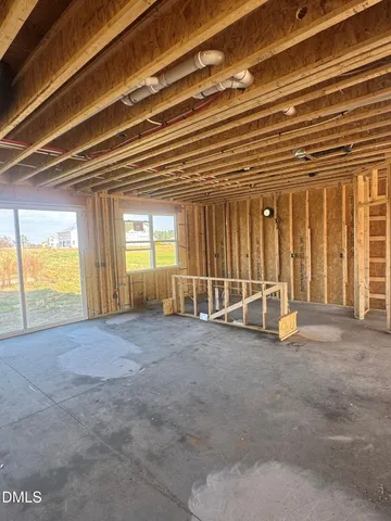 a view of an empty room with a balcony