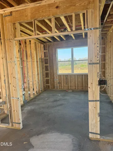a kitchen with stainless steel appliances kitchen island a table and chairs in it