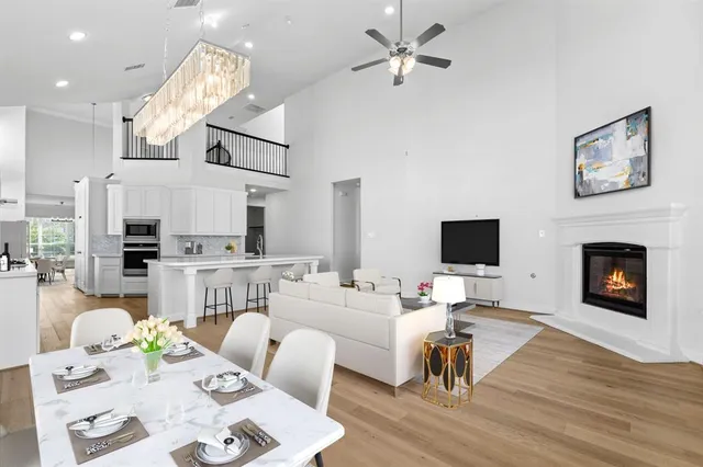 a living room with furniture fireplace and flat screen tv