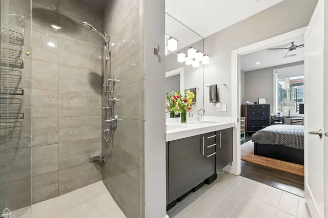 a spacious bathroom with a double vanity sink shower and mirror