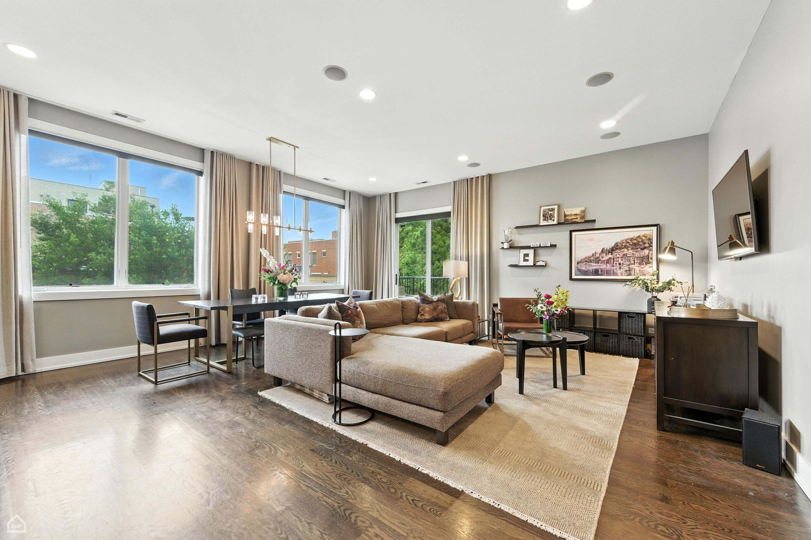 1312 West Madison Street, Unit 3A Chicago, IL 60607 - Photo 3 of 21 a living room with furniture and a flat screen tv