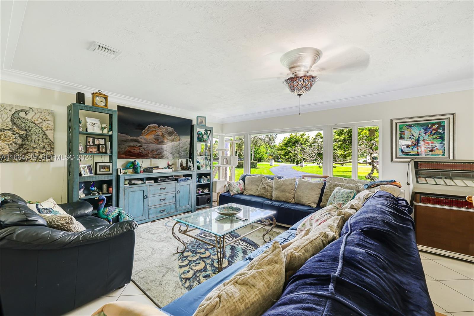17421 Southwest 300th Street Homestead, FL 33030 - Photo 14 of 62 a living room with furniture and a flat screen tv