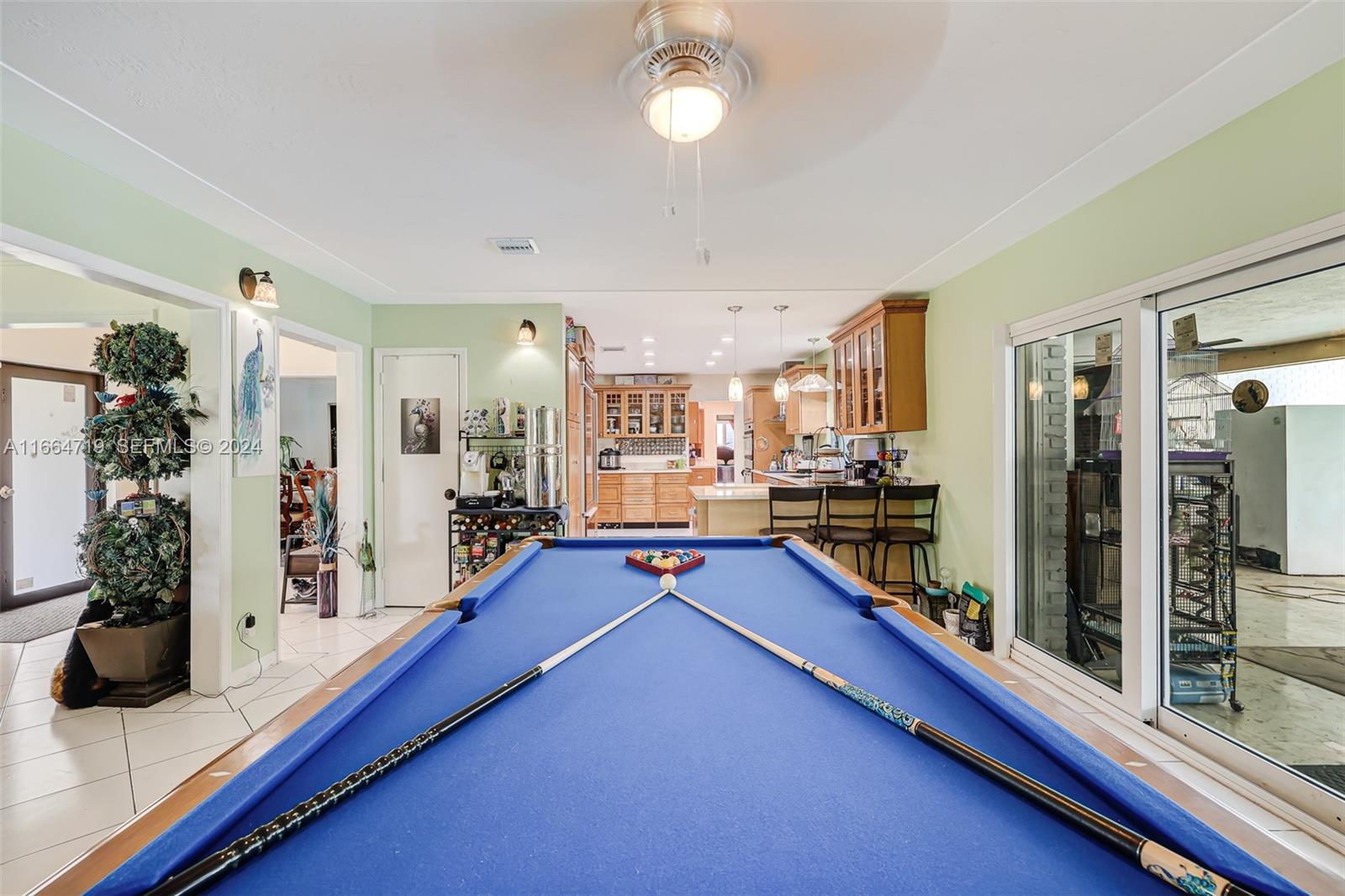 17421 Southwest 300th Street Homestead, FL 33030 - Photo 19 of 62 a room with lots of counter top space and furniture