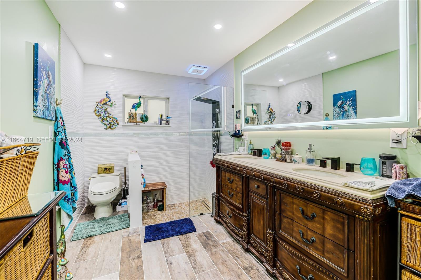 17421 Southwest 300th Street Homestead, FL 33030 - Photo 23 of 62 a kitchen with stainless steel appliances a stove a wooden floor and cabinets
