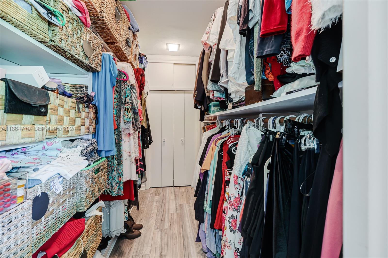 17421 Southwest 300th Street Homestead, FL 33030 - Photo 24 of 62 a view of walk in closet with clothes and shoes