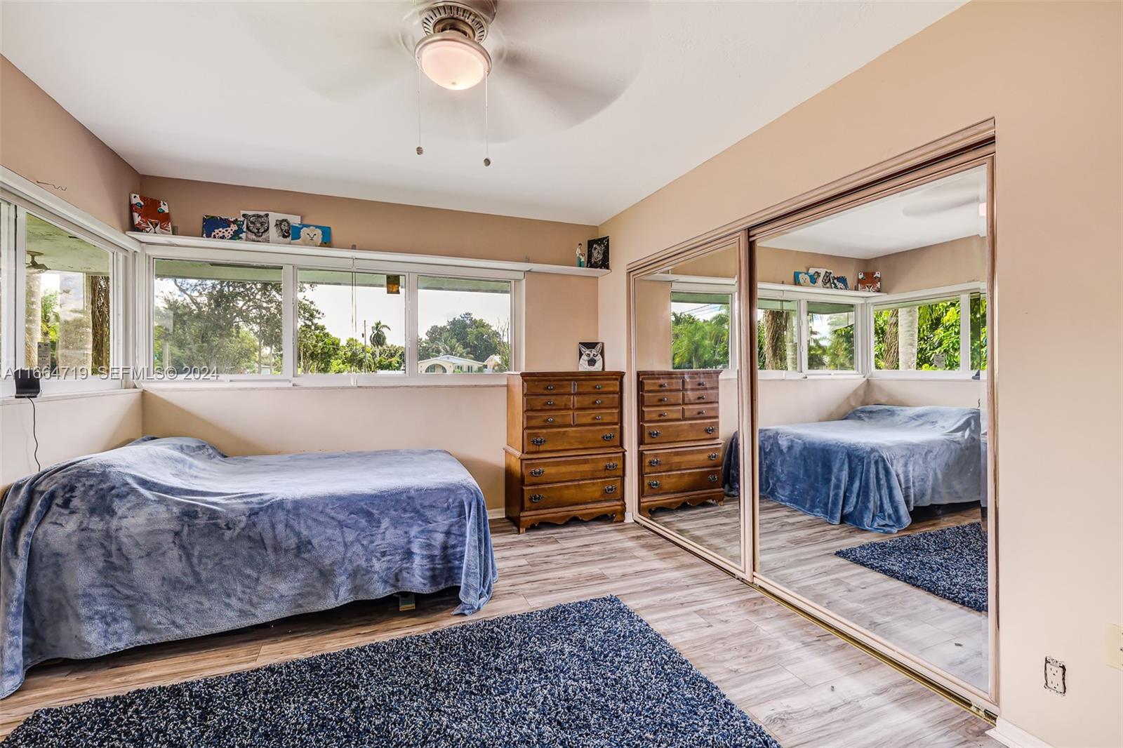 17421 Southwest 300th Street Homestead, FL 33030 - Photo 26 of 62 a bedroom with a bed and large window