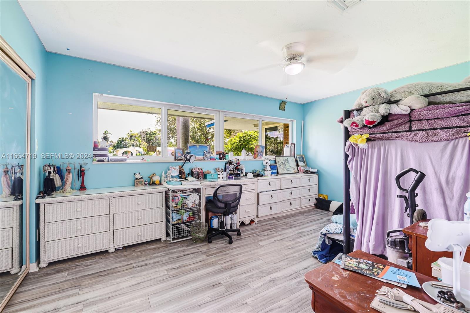 17421 Southwest 300th Street Homestead, FL 33030 - Photo 27 of 62 a room with furniture a rug toys and a window