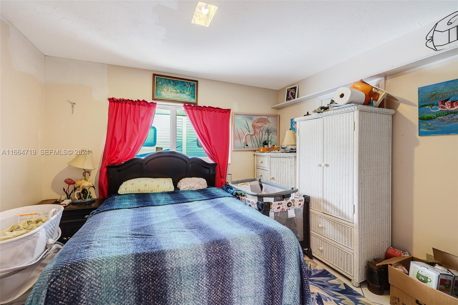 17421 Southwest 300th Street Homestead, FL 33030 - Photo 35 of 62 a bedroom with a bed and a closet