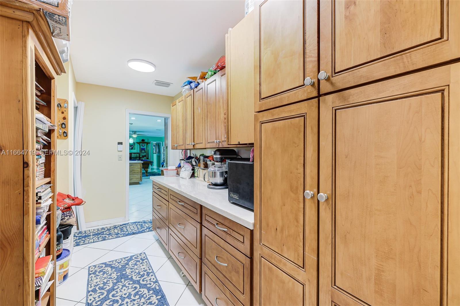 17421 Southwest 300th Street Homestead, FL 33030 - Photo 36 of 62 a kitchen with stainless steel appliances granite countertop a refrigerator and a sink