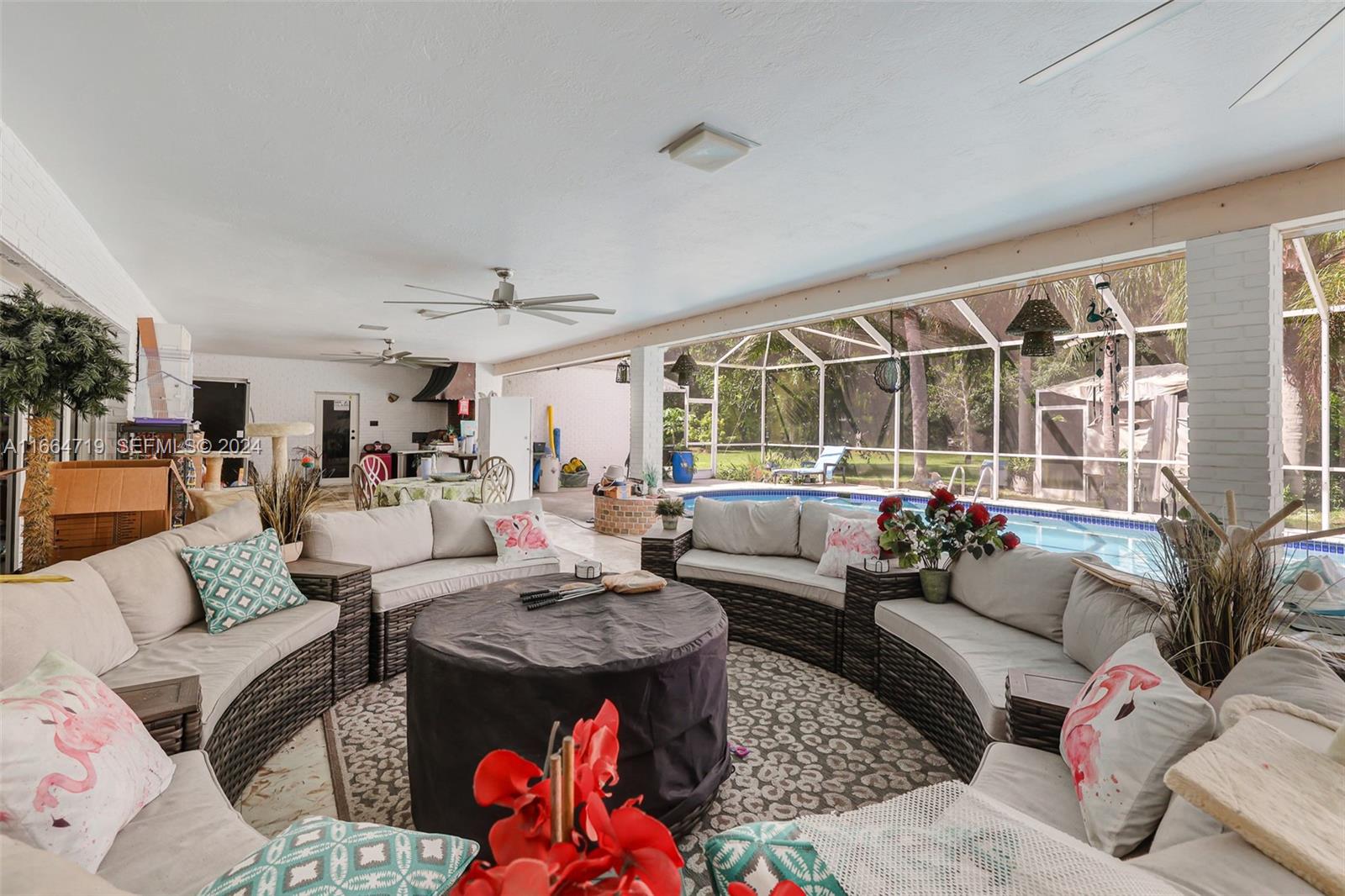 17421 Southwest 300th Street Homestead, FL 33030 - Photo 41 of 62 a living room with furniture and a large window