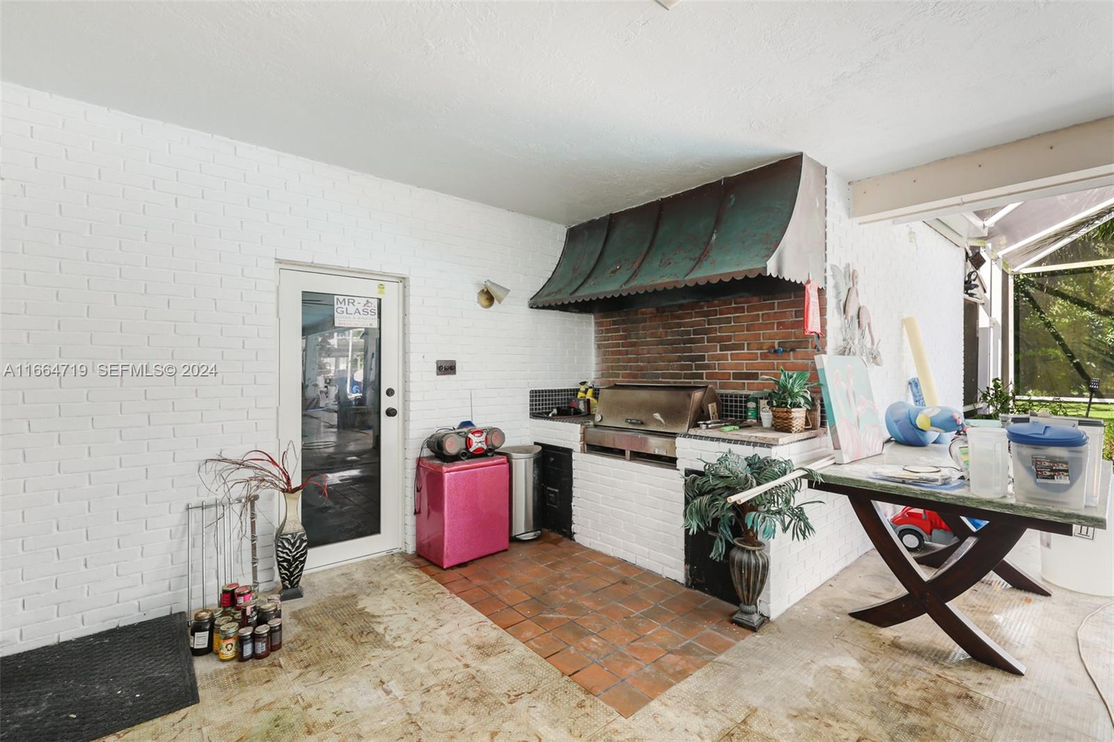 17421 Southwest 300th Street Homestead, FL 33030 - Photo 43 of 62 a kitchen with granite countertop a stove a sink dishwasher and a refrigerator with wooden floor