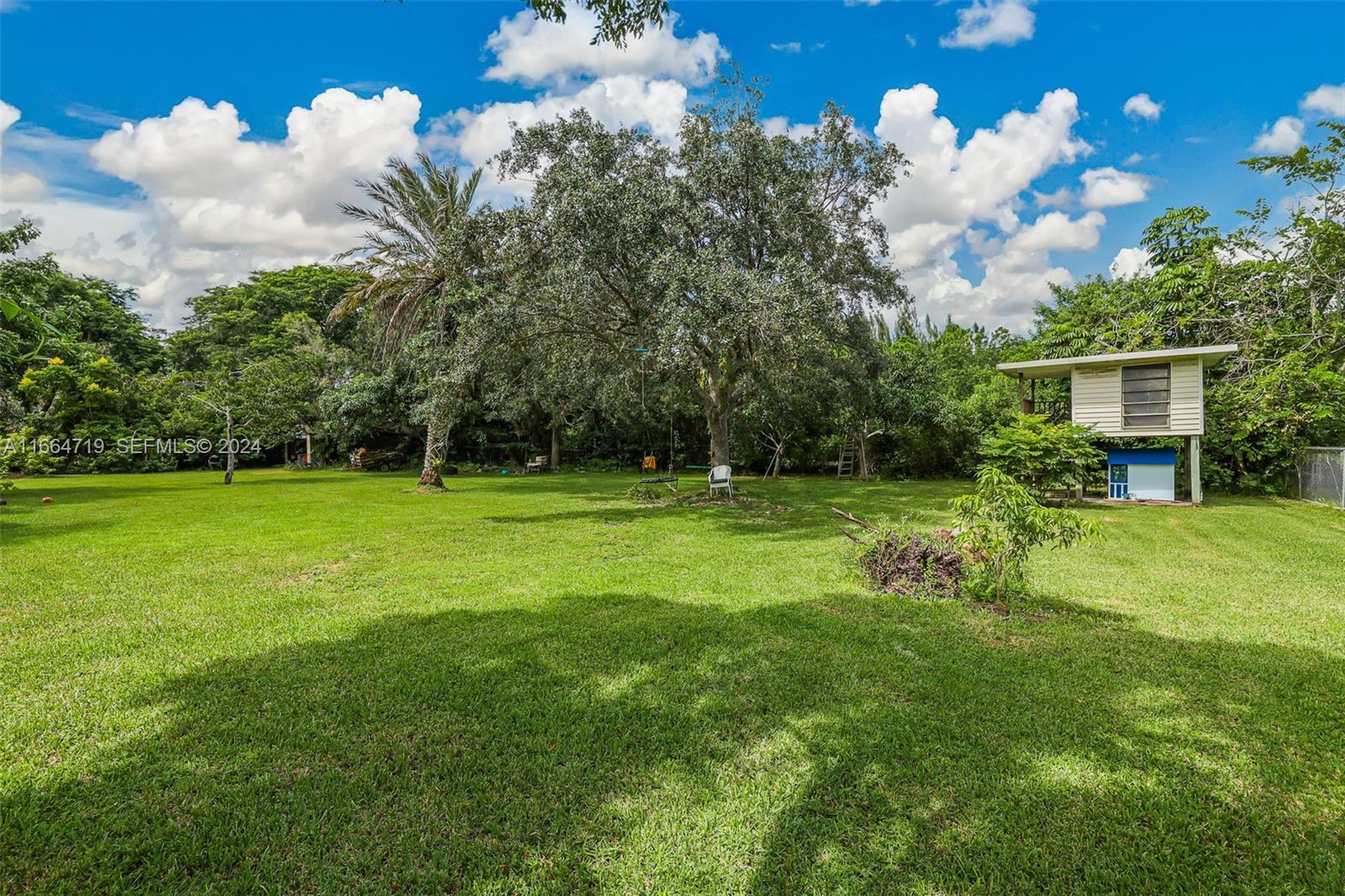 17421 Southwest 300th Street Homestead, FL 33030 - Photo 52 of 62 a view of a house with a big yard