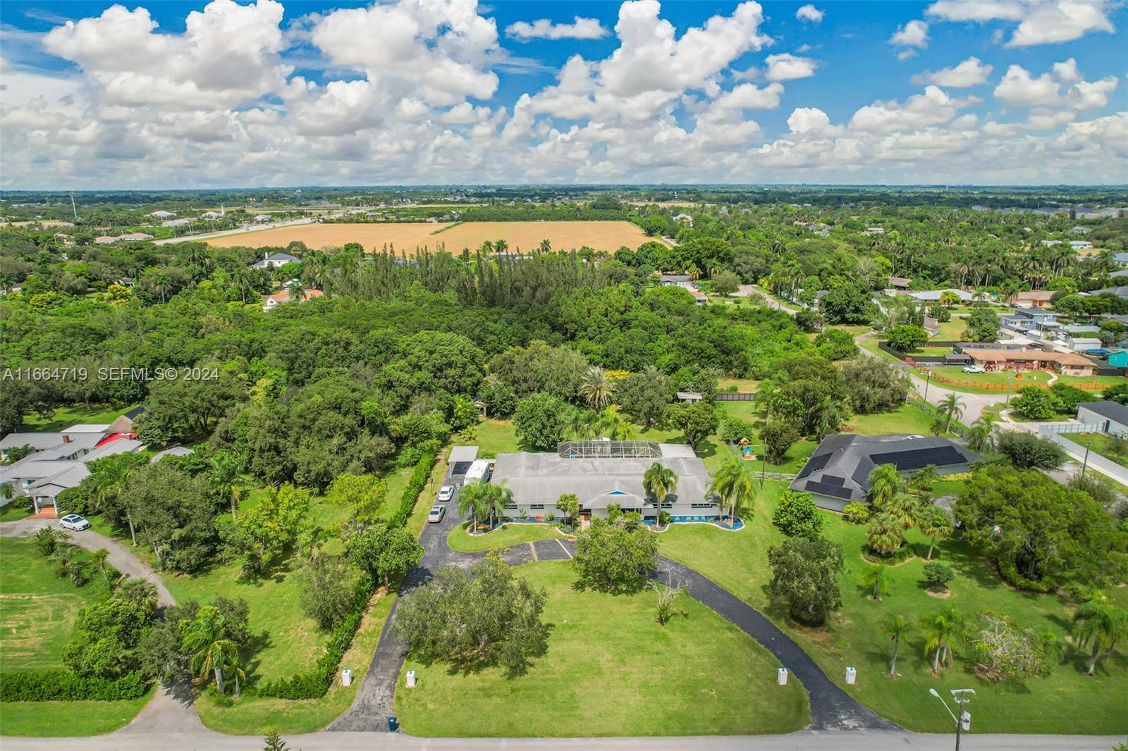 17421 Southwest 300th Street Homestead, FL 33030 - Photo 54 of 62 an aerial view of residential houses with outdoor space and trees