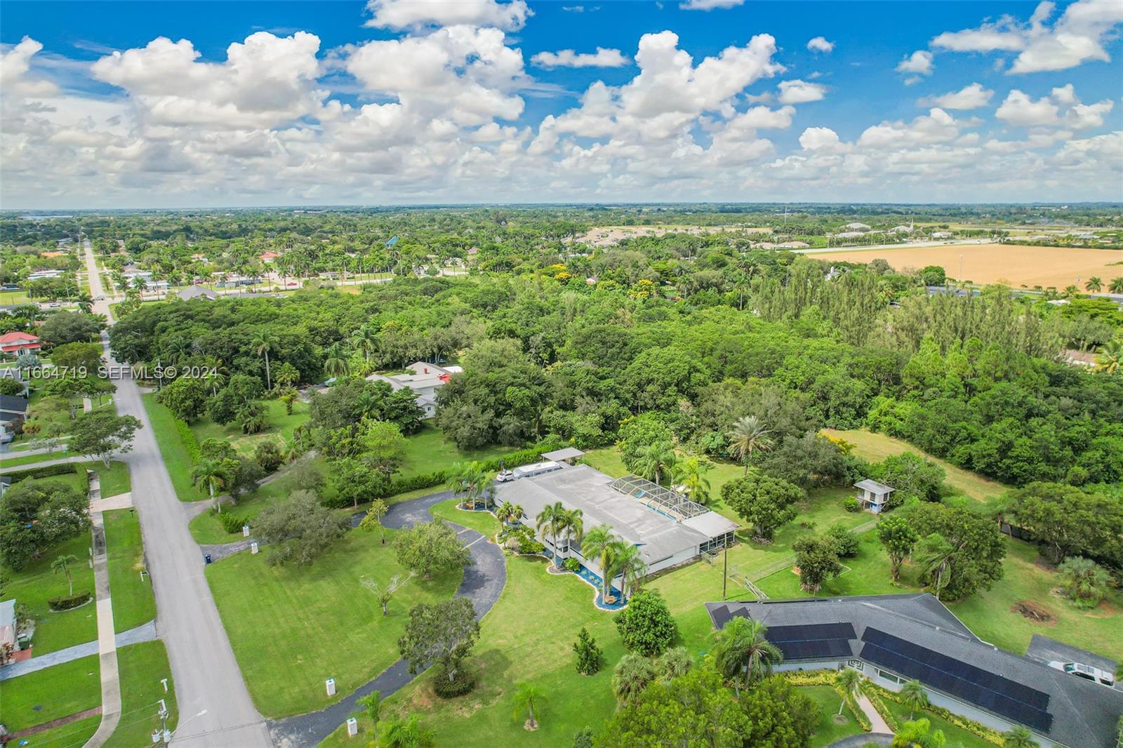 17421 Southwest 300th Street Homestead, FL 33030 - Photo 55 of 62 a view of a yard with an outdoor seating
