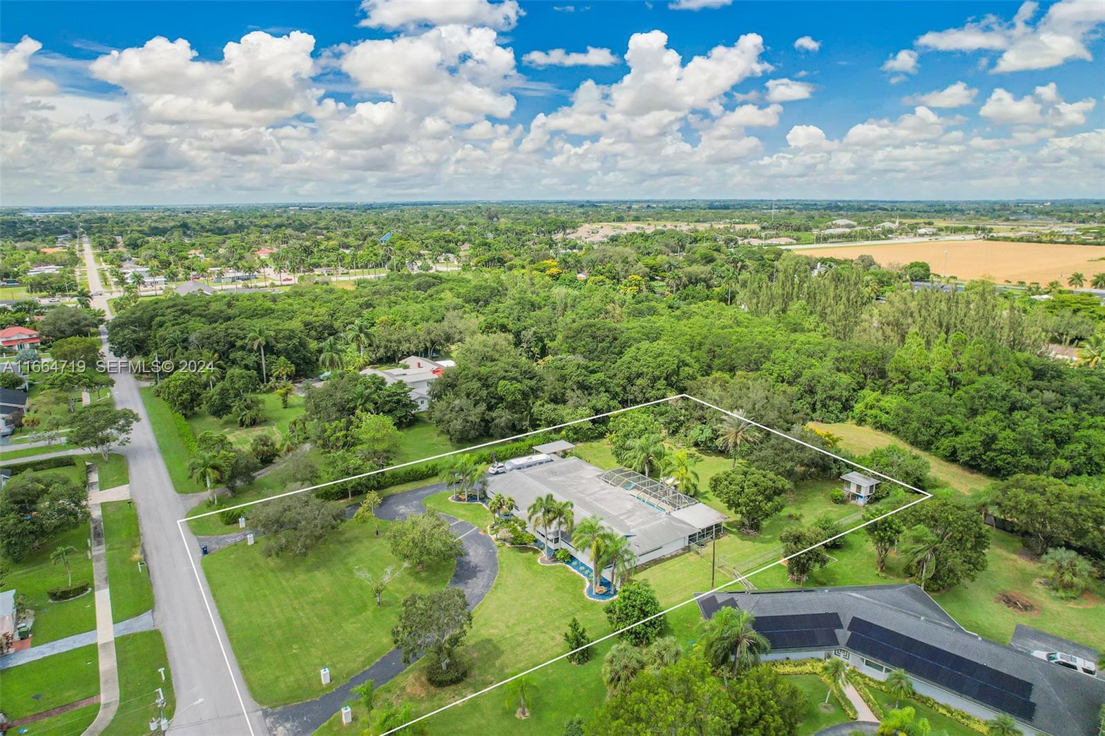17421 Southwest 300th Street Homestead, FL 33030 - Photo 56 of 62 a view of a lake with a yard