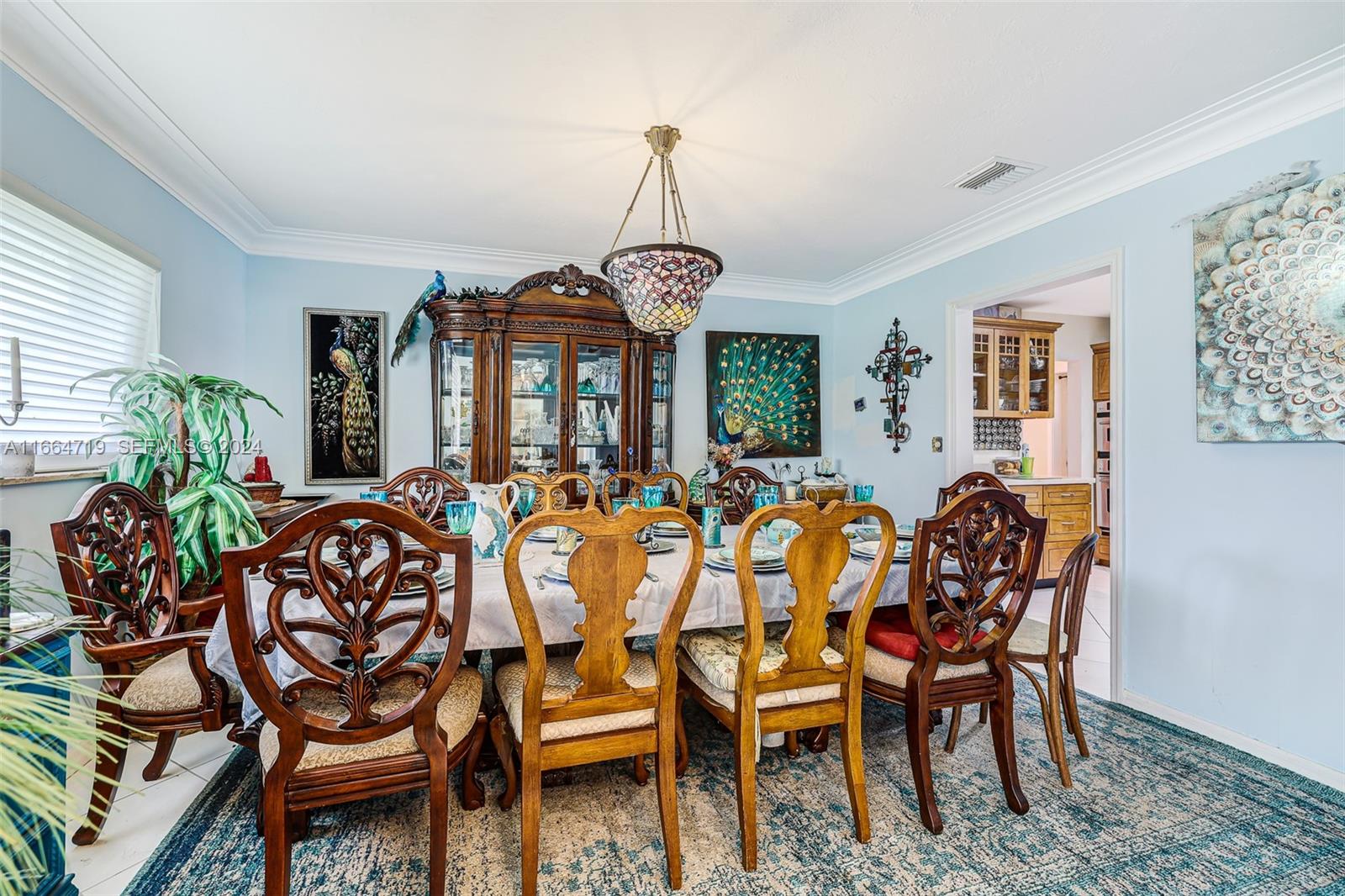 17421 Southwest 300th Street Homestead, FL 33030 - Photo 7 of 62 a view of a dining room with furniture and window
