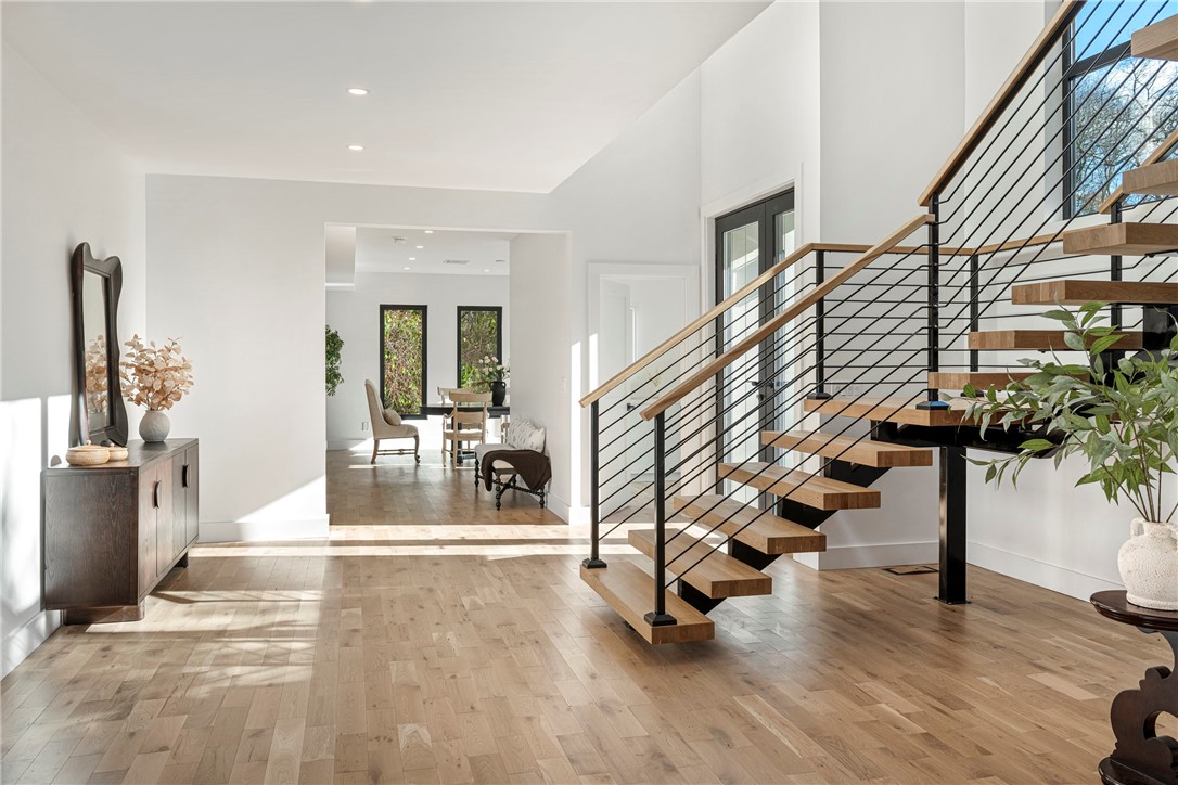 19 Castle Road Narragansett, RI 02882 - Photo 6 of 45 Front Entry with Signature Floating Staircase flooded w Natural Light