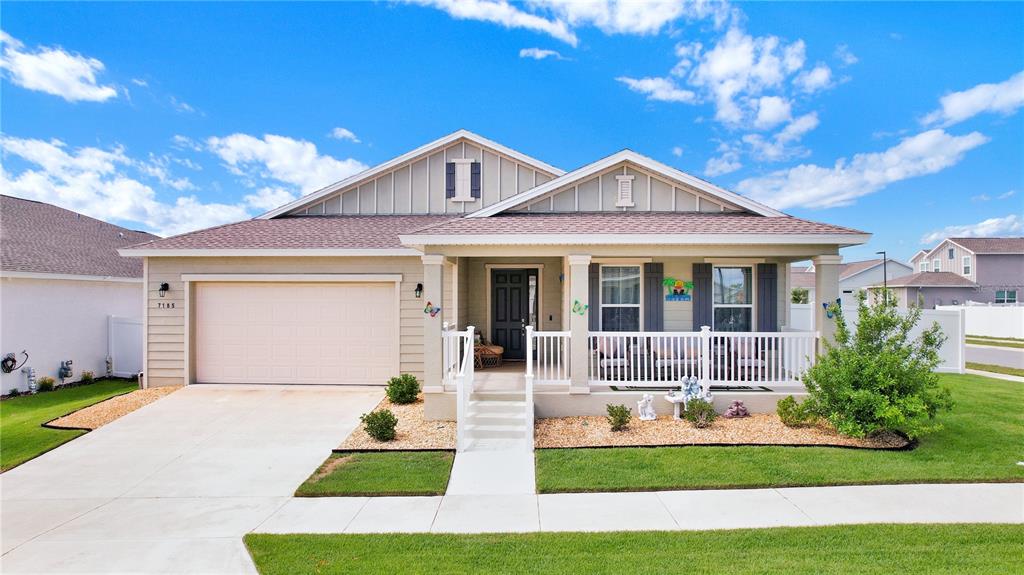 7185 Southwest 63rd Street Ocala, FL 34474 - Photo 1 of 31 a front view of a house with garden