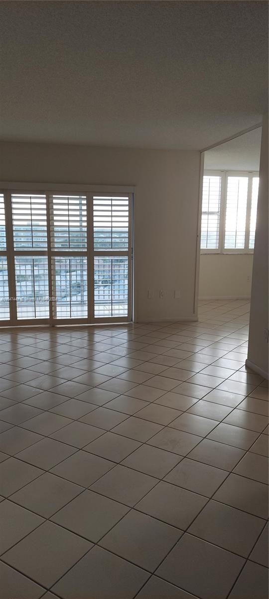 3850 Washington Street, Unit 1110 Hollywood, FL 33021 - Photo 23 of 29 wooden floor in an empty room with a window