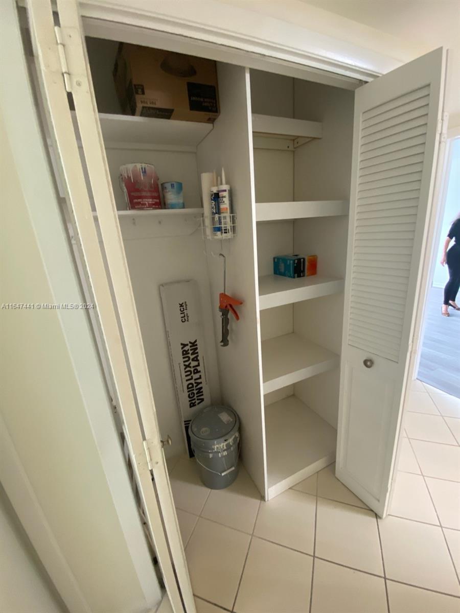 3850 Washington Street, Unit 1110 Hollywood, FL 33021 - Photo 26 of 29 a storage room with wooden floor and cabinets