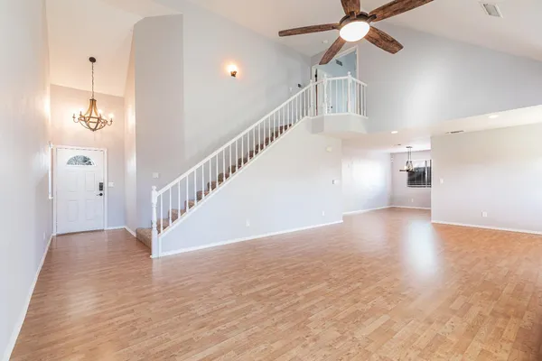 a view of an entryway with wooden floor