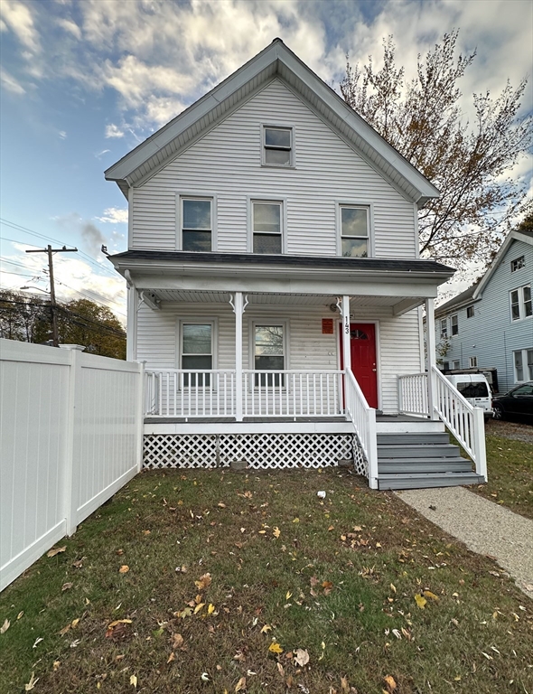 143 Arlington Street, Unit 1 Framingham, MA 01702 - Photo 1 of 20 a front view of a house with a garden