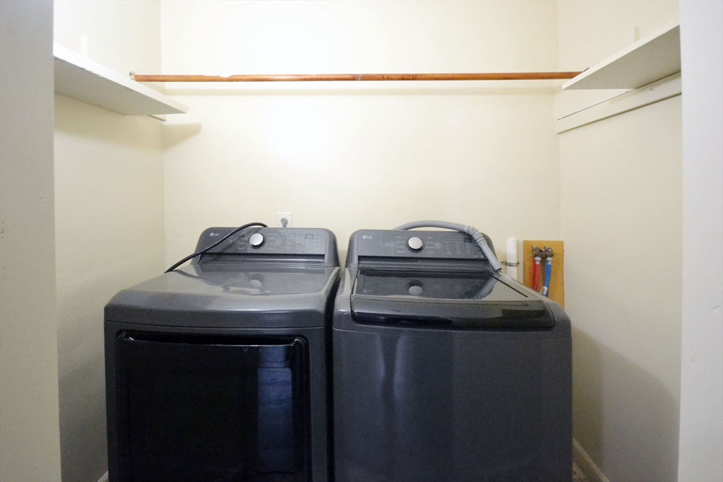 143 Arlington Street, Unit 1 Framingham, MA 01702 - Photo 8 of 20 a utility room with dryer and washer