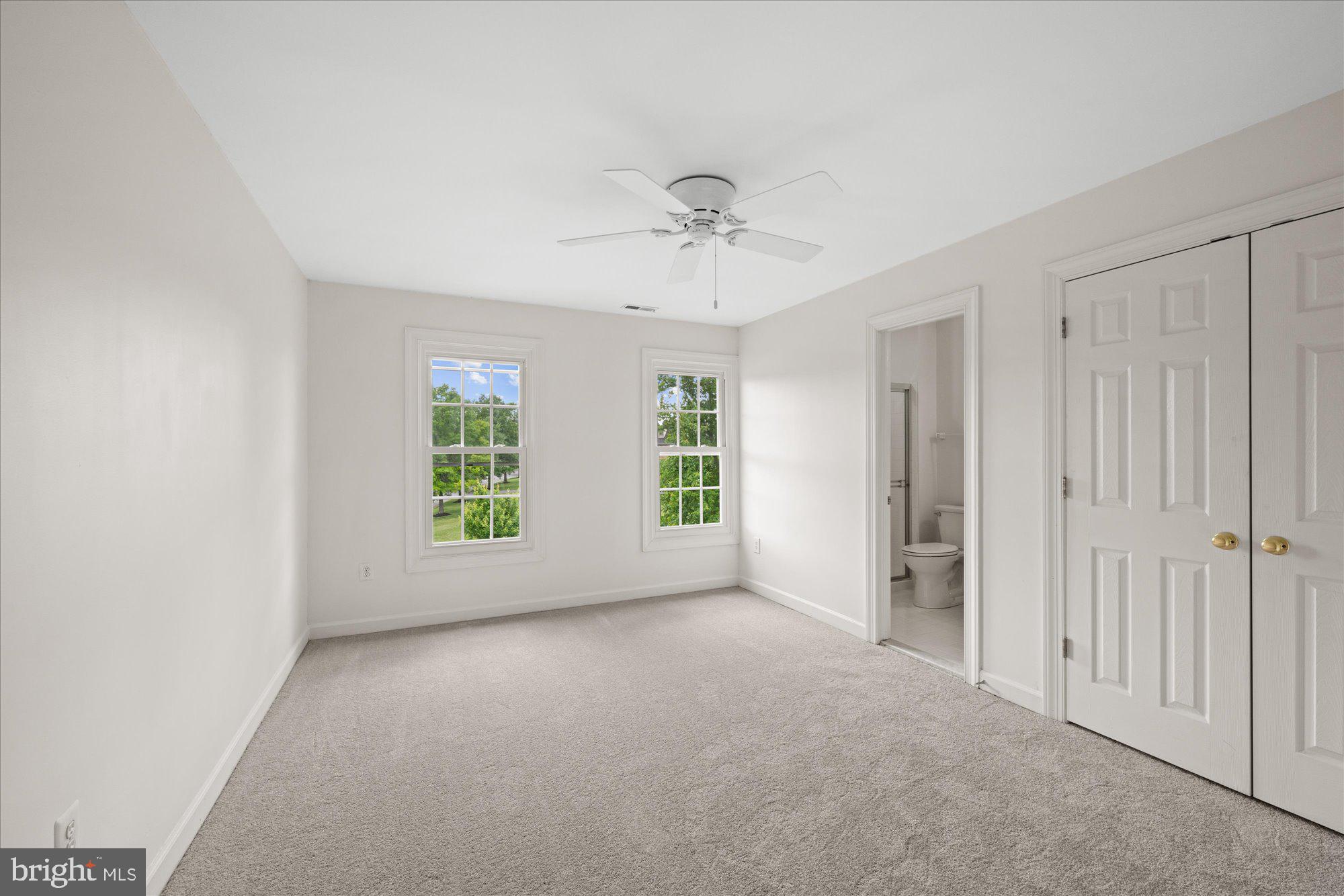 17017 Spates Hill Road Poolesville, MD 20837 - Photo 29 of 59 Bedroom Two with ceiling fan and en suite bath