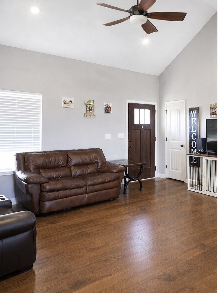 809 Hooper Road Charlotte, TN 37036 - Photo 4 of 14 a living room with furniture and a wooden floor