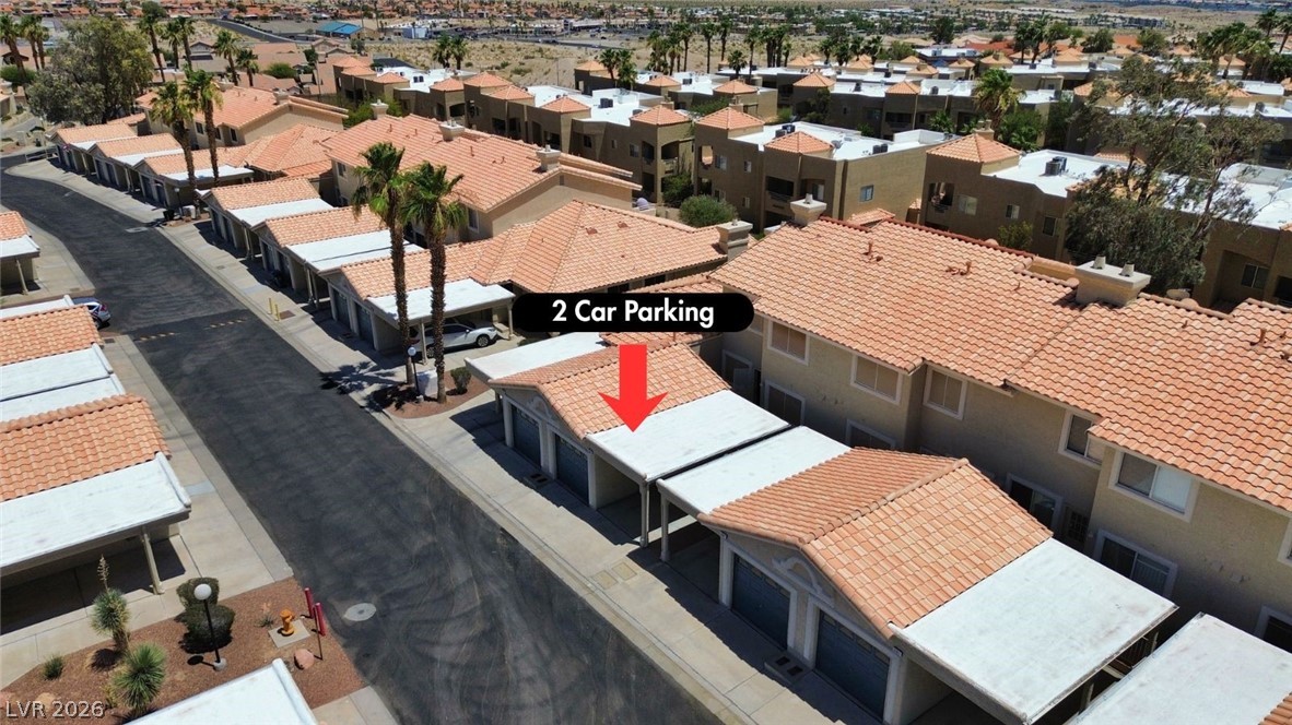 2243 Rugged Mesa Drive Laughlin, NV 89029 - Photo 5 of 32 An aerial perspective reveals organized rows of residential structures with ample parking.