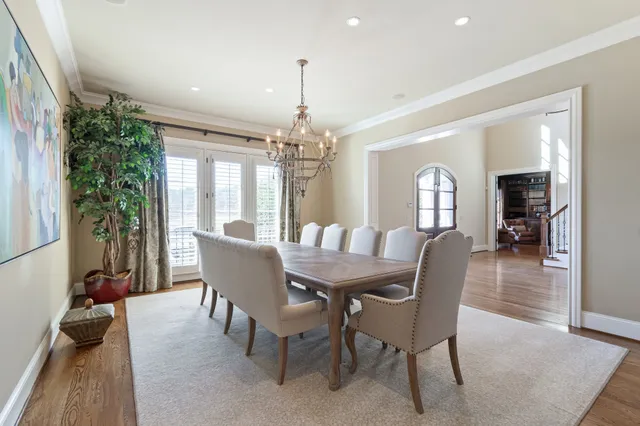 a living room with furniture a fireplace and a table
