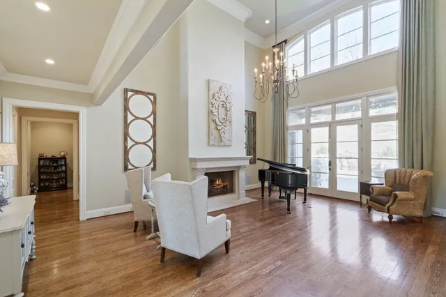a kitchen with kitchen island granite countertop a sink a stove and a refrigerator