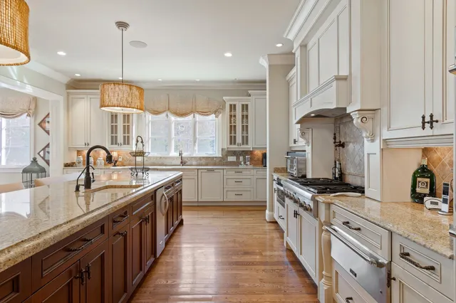 a view of a living room with furniture and stairs