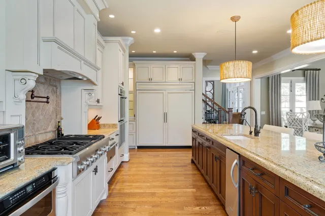 a spacious bathroom with a granite countertop sink and a mirror