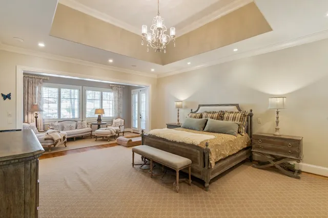 an aerial view of residential houses with outdoor space and trees