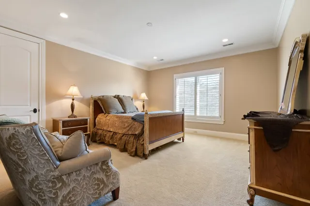 an aerial view of residential house with outdoor space and trees all around