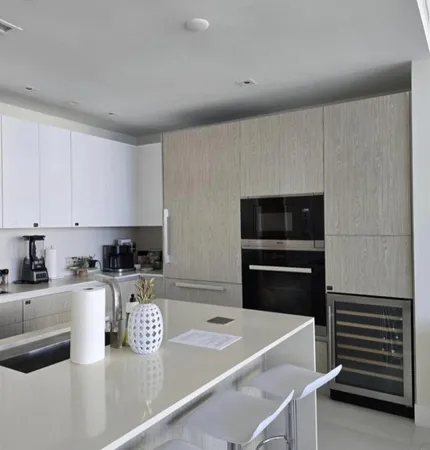a kitchen with a sink a stove and refrigerator
