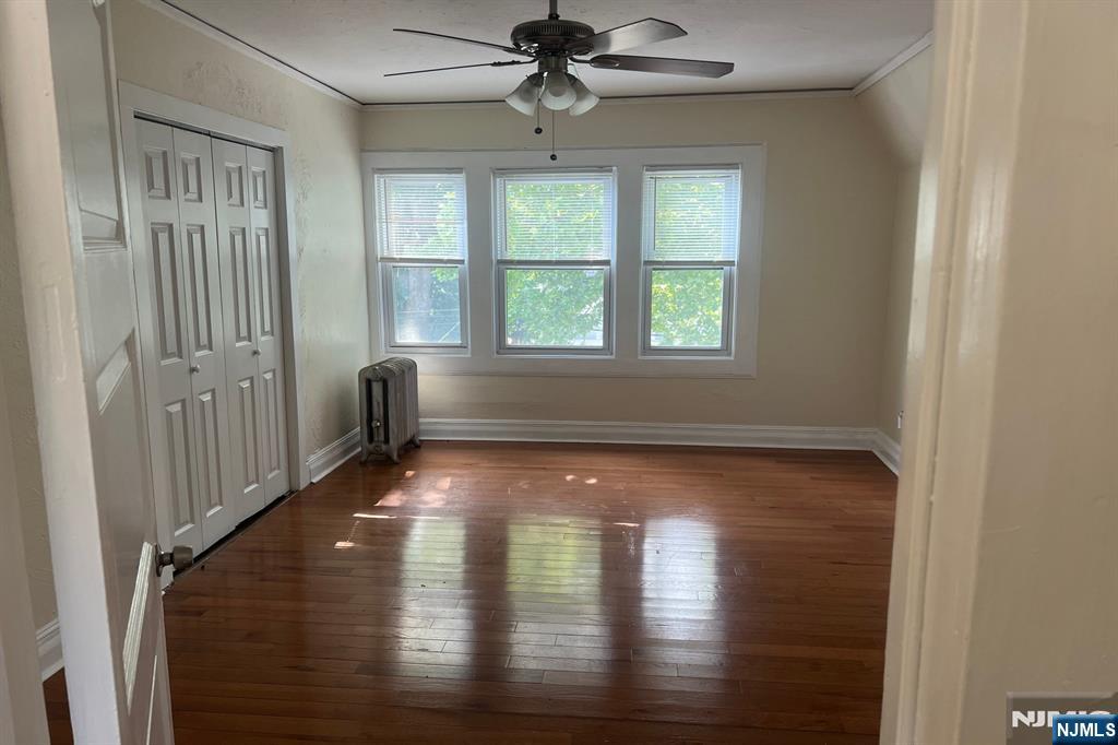19 Spring Street, Unit 2 Bloomfield, NJ 07003 - Photo 13 of 19 a view of dining room with wooden floor fan and a window