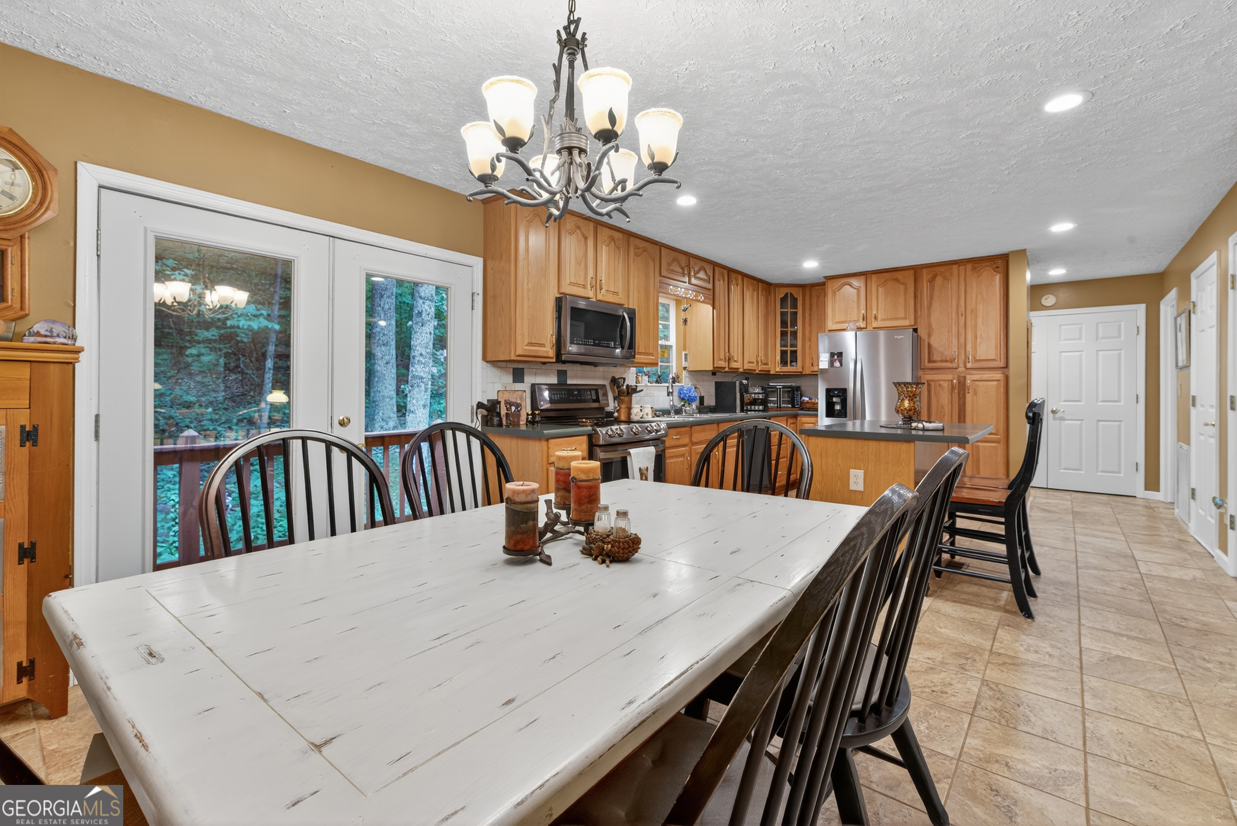 75 Juniper Trail Clayton, GA 30525 - Photo 11 of 38 a view of a dining room with furniture a chandelier and wooden floor